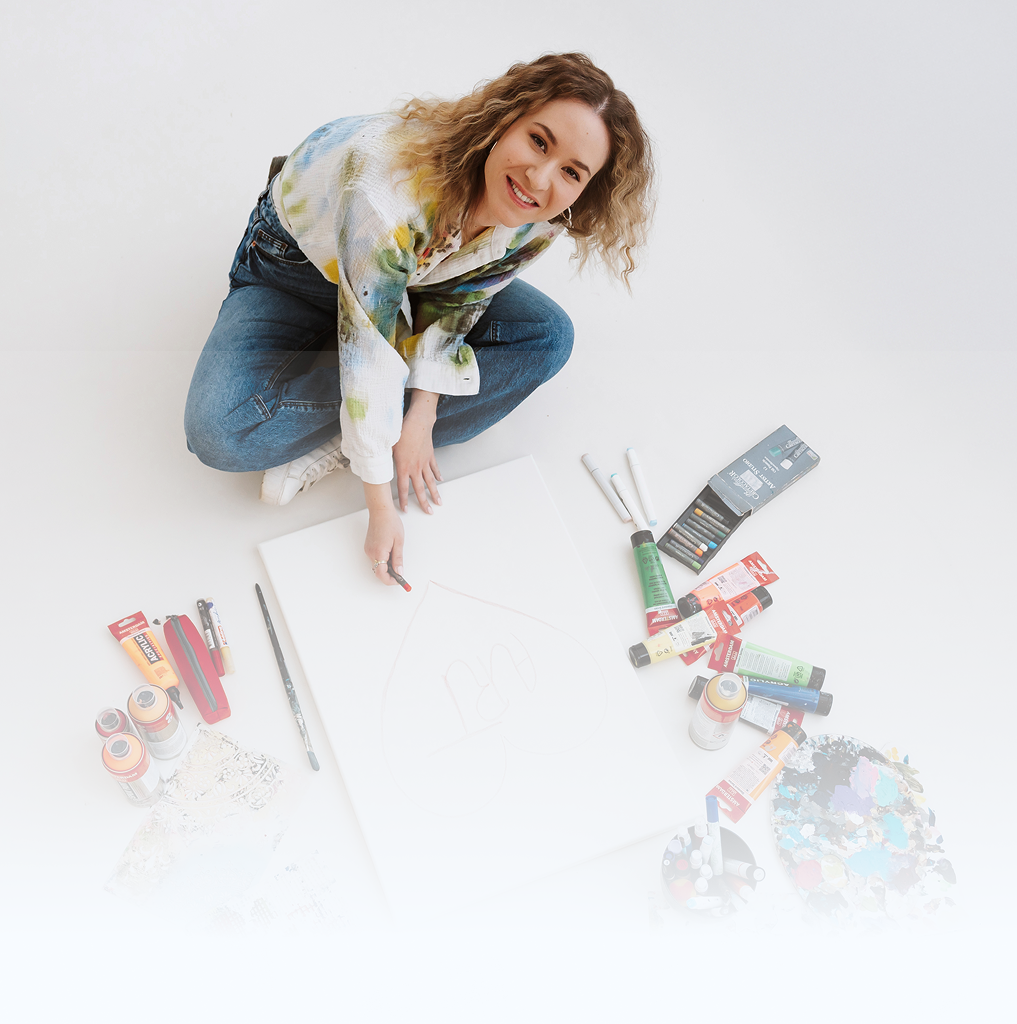 Nina painting in her studio, seen from above